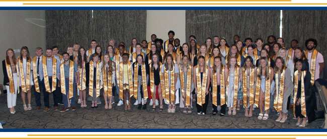 Group of students getting ready to graduate
