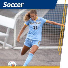 Student kicking a soccer ball