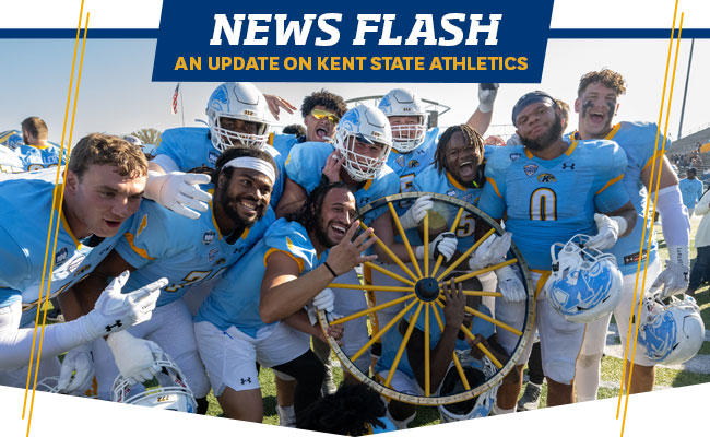 News Flash - An Update on Kent State Athletics - Football players holding wagon wheel
