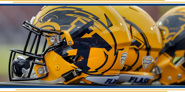 Image of Golden Flash football helmets
